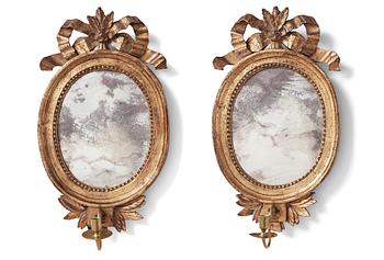 92. A pair of Gustavian late 18th century one-light girandole mirrors.