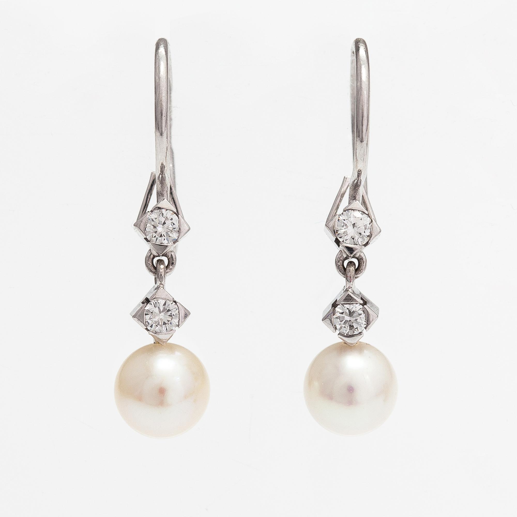 A pair of 18K white gold earrings with cutured pearls and diamonds ca. 0.24 ct in total. Westerback, Helsinki.