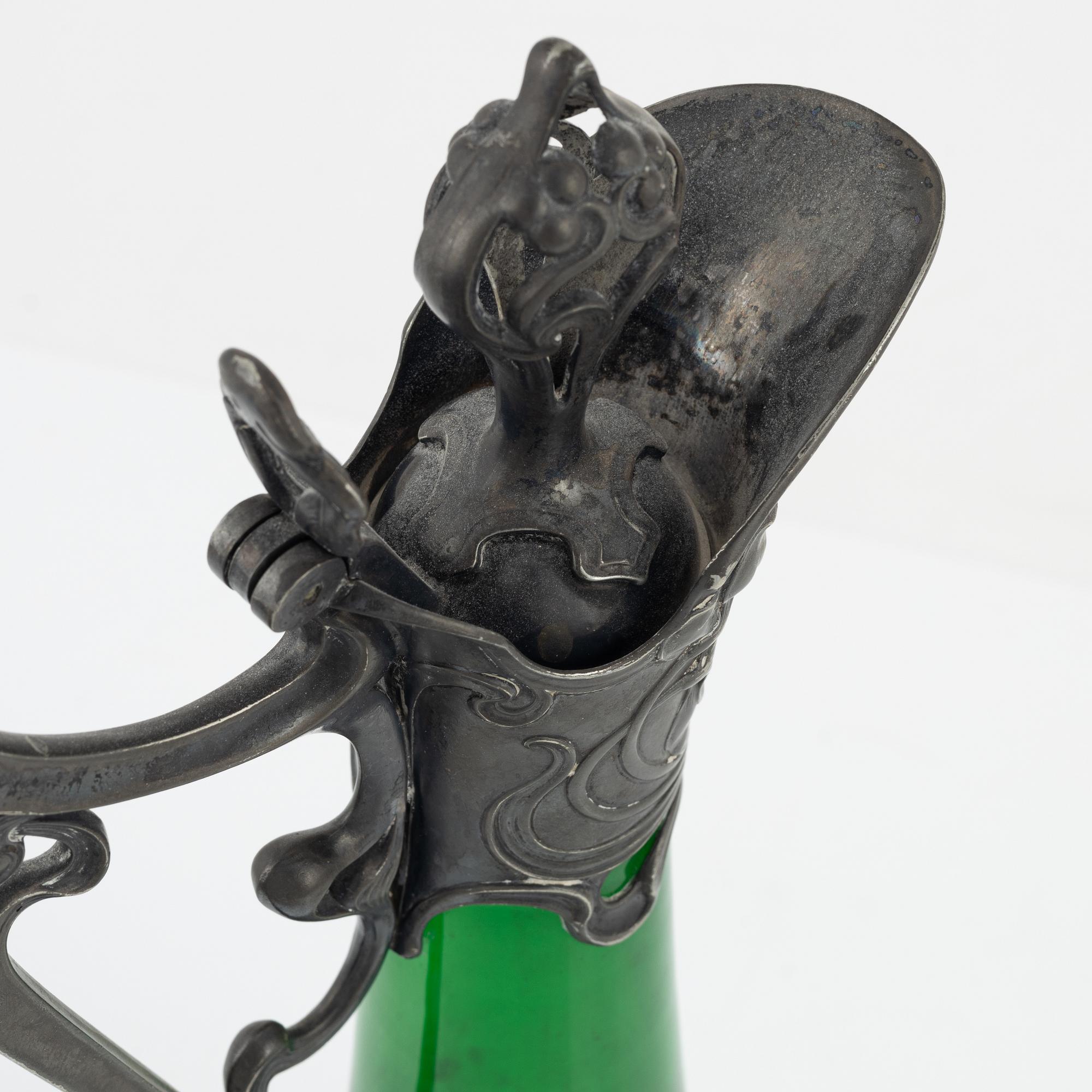 A silver plate and glass decanter, Art Nouveau, early 20th century.