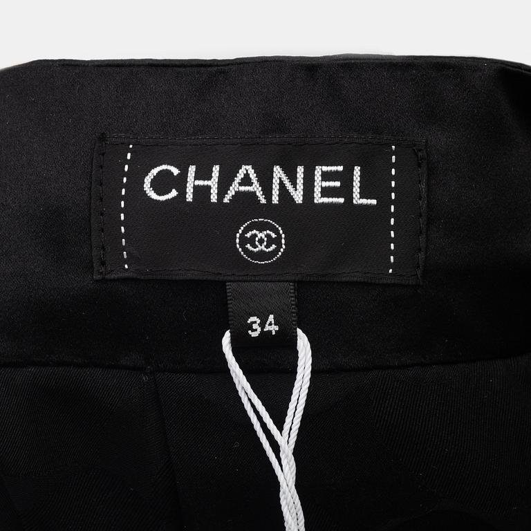 Chanel, a black silk skirt with a collar/top, size 34.