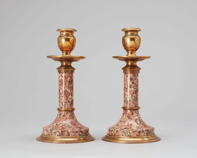 A pair of Swedish 19th cent granite-like and brass candlesticks.