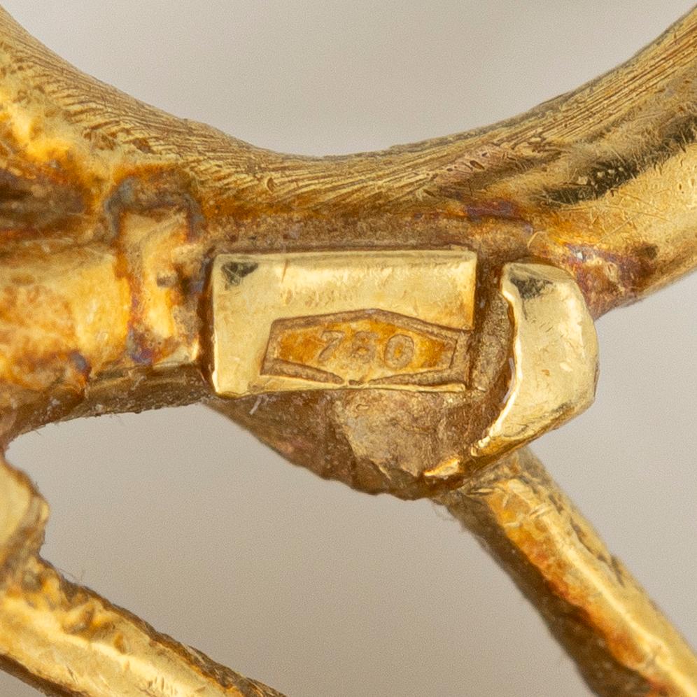 Brosch i form av en fågel 18K guld med åttkantslipade diamanter.