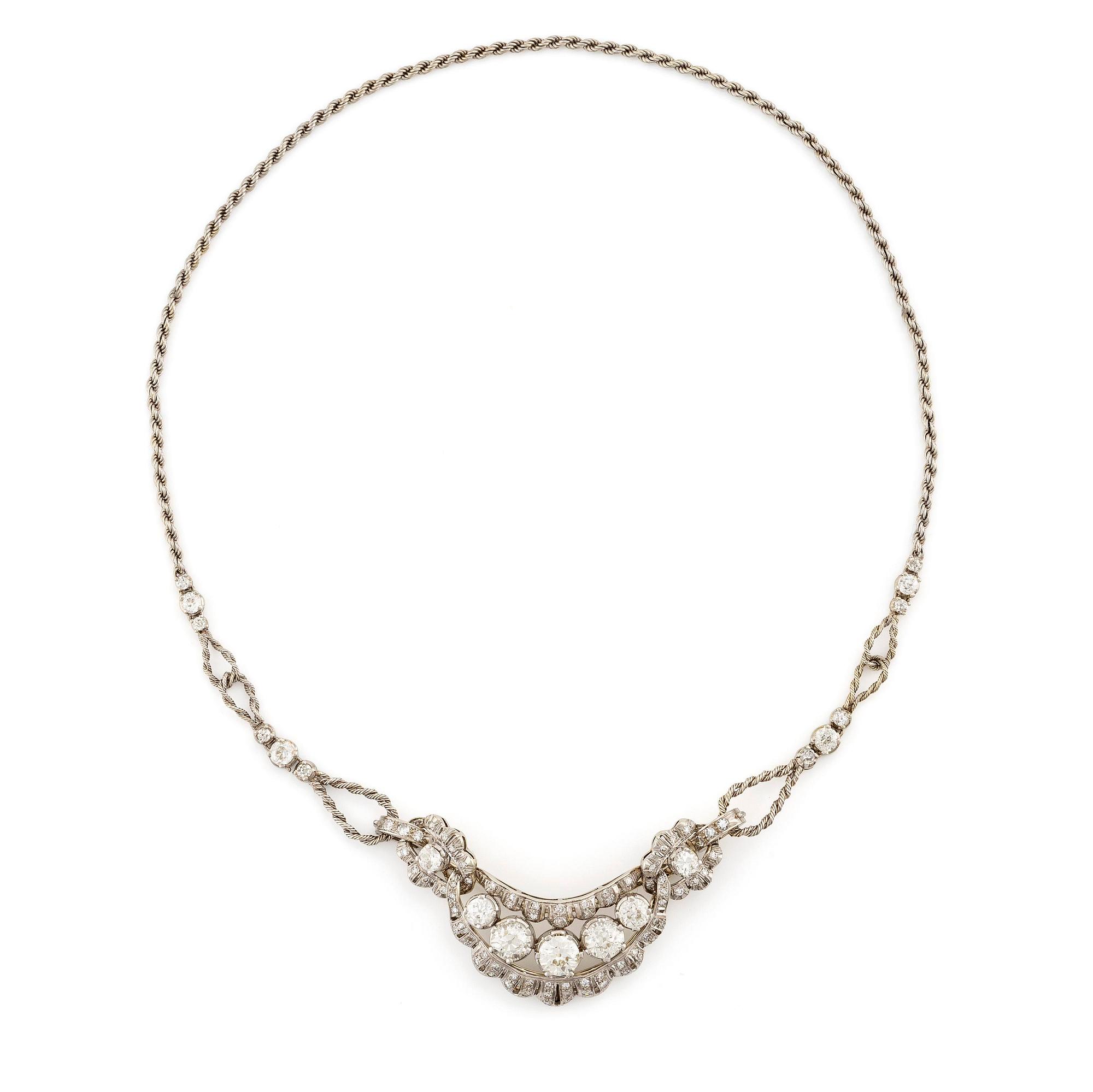 A brooch/necklace combination in 18K white gold set with old- and eight-cut diamonds.