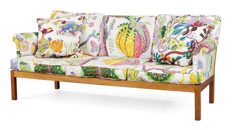 A Josef Frank cherry and ratten sofa for Svenskt Tenn, model 1100.