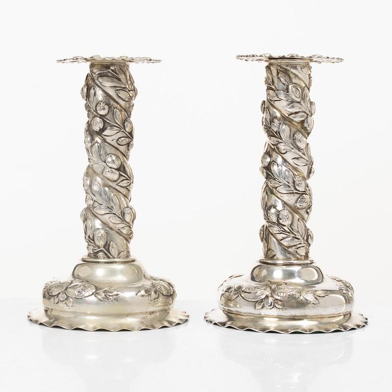 A pair of Baroque-style silver candle sticks, with Swedish import marks, first half of the 20th century.