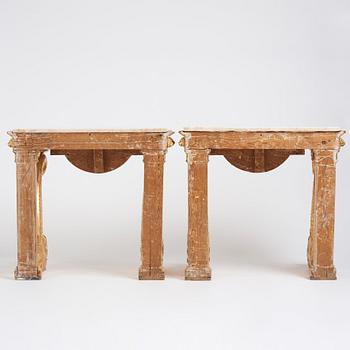 A pair of Swedish Empire carved and giltwood console tables, first half of the 19th century.