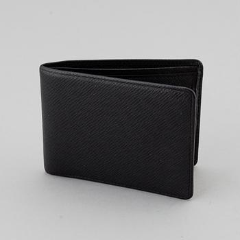 LOUIS VUITTON, black taiga leather wallet.