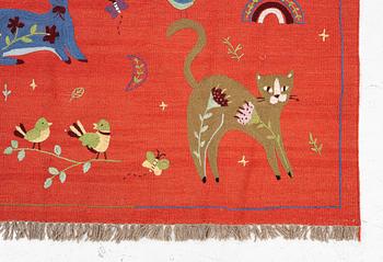 A hand-embroidered Kilim rug, c. 182 x 122 cm.