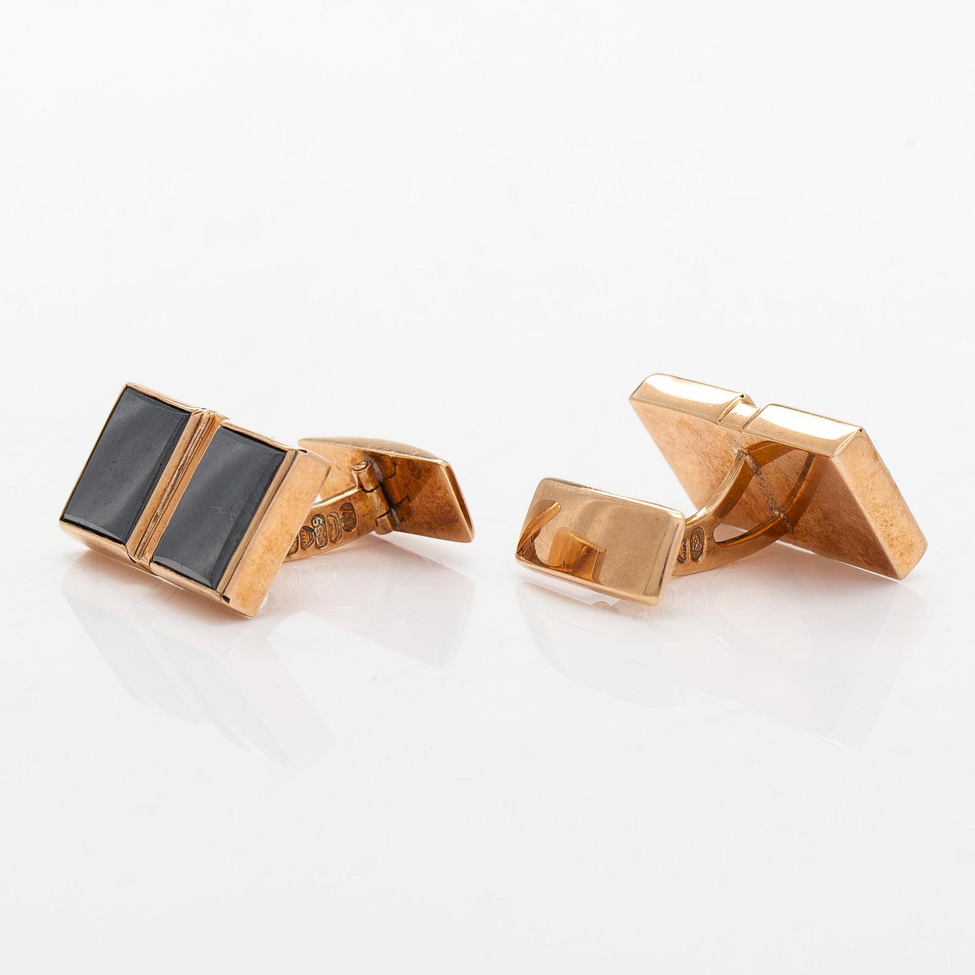 Kalvosinnapit, 14K kultaa ja hematiitit, Kaisaniemen Kello ja Kulta 1962.