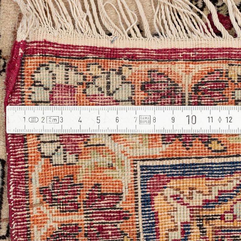 A pair of antique Kerman Raver rugs, c. 215-220 x 135-139 cm.
