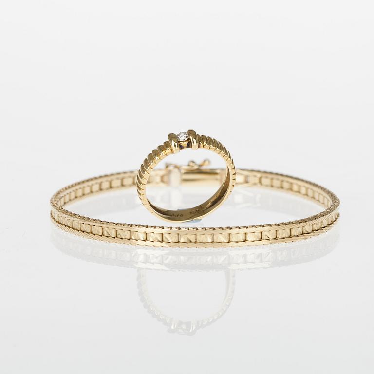 ARMRING och RING, 14/18K guld, briljantslipad diamant ca 0,15 ct. Vikt tot. 12,2 g.