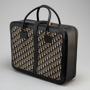 CHRISTIAN DIOR, a suitcase.