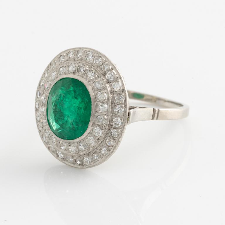 Ring, platinum with emerald and octagonal cut diamonds.