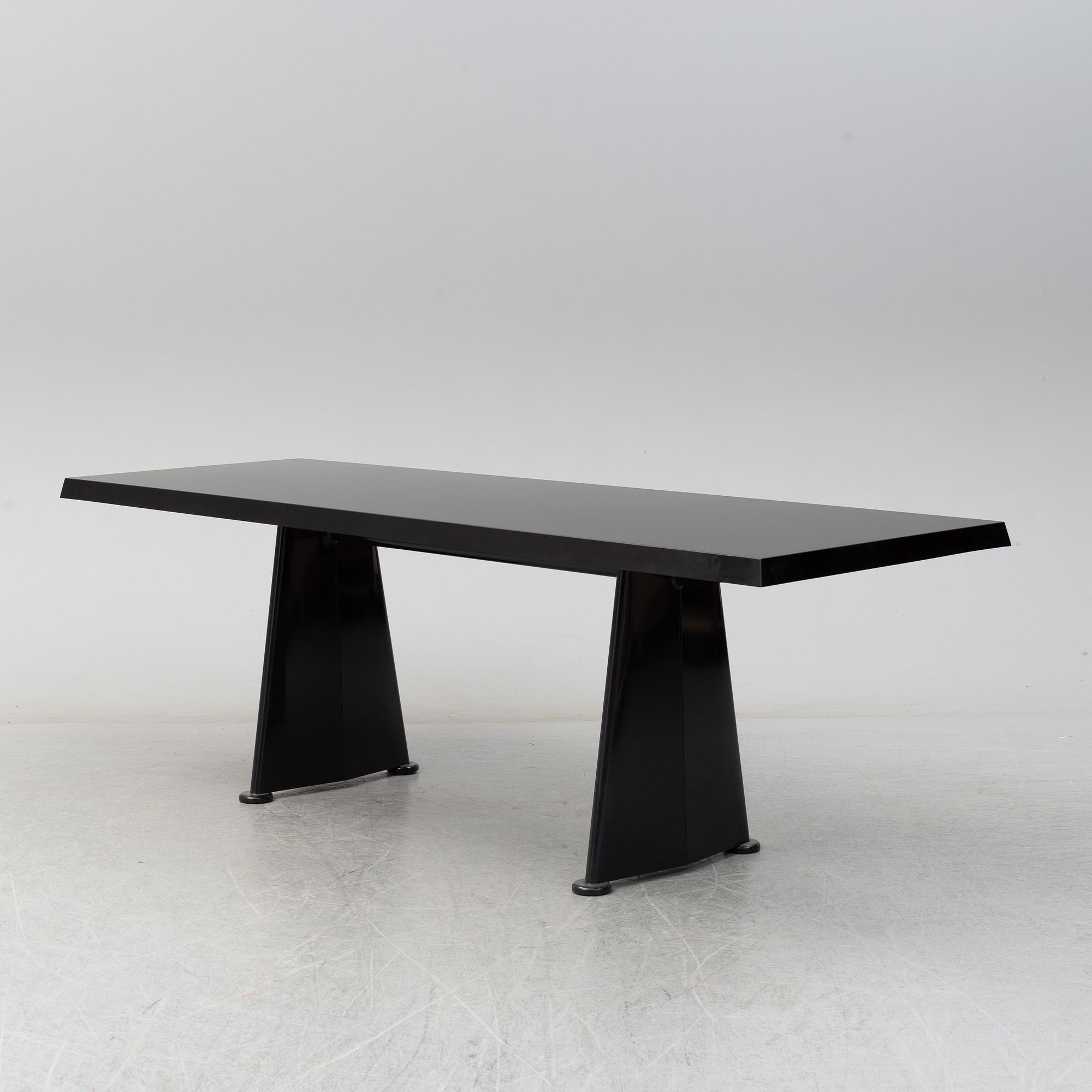 A 'Trapeze' dinner table by Jean Prouvé, Vitra, 2002.