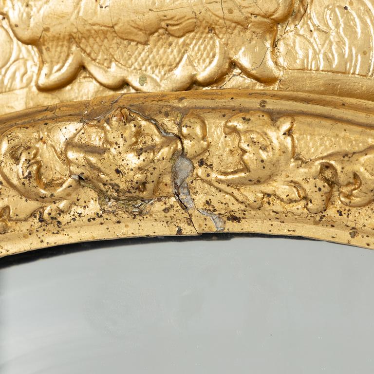 A North European late baroque giltwood mirror, first part of the 18th century.