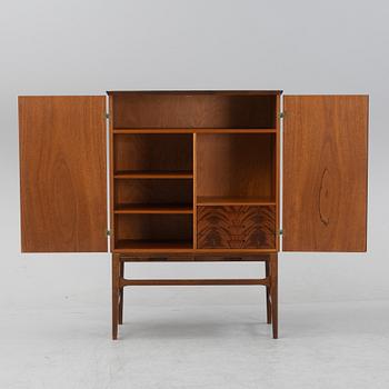 A beech and mahogany mid 20th century cabinet.