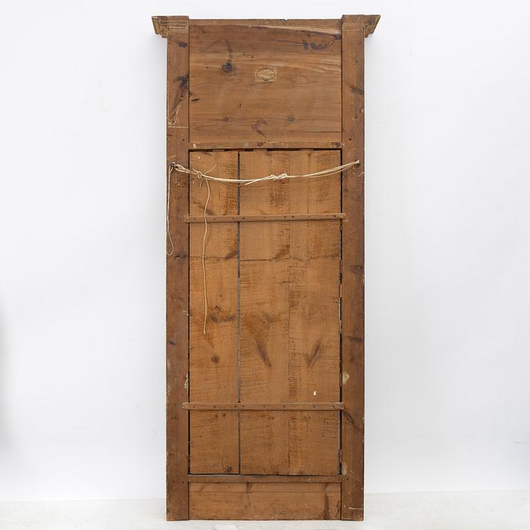 Empire, A late Empire mirror, first half of the 19th century.