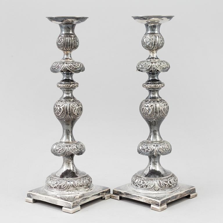 A pair of silver Sabbath candlesticks, Maker M. Sztern, Warsaw, Poland. Assayer Josef Sosnkowski, 1864. Weight 833 g.