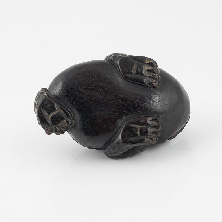 A wooden brushpot in the shape of a three legged toad, China, 20th Century.