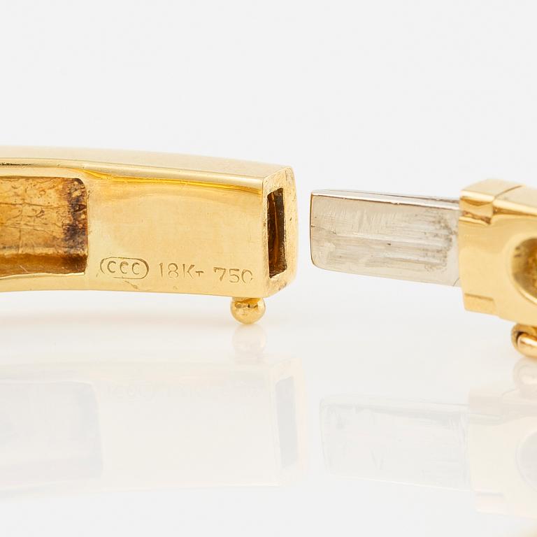 Bangle in 18K gold set with brilliant-cut diamonds.
