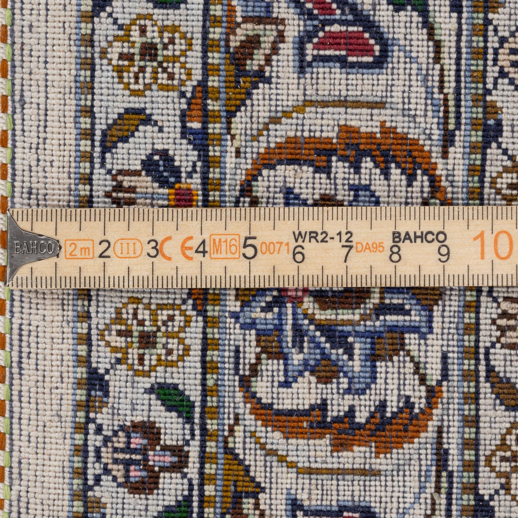A semi-antique silk Keshan carpet, c. 350 x 248 cm.