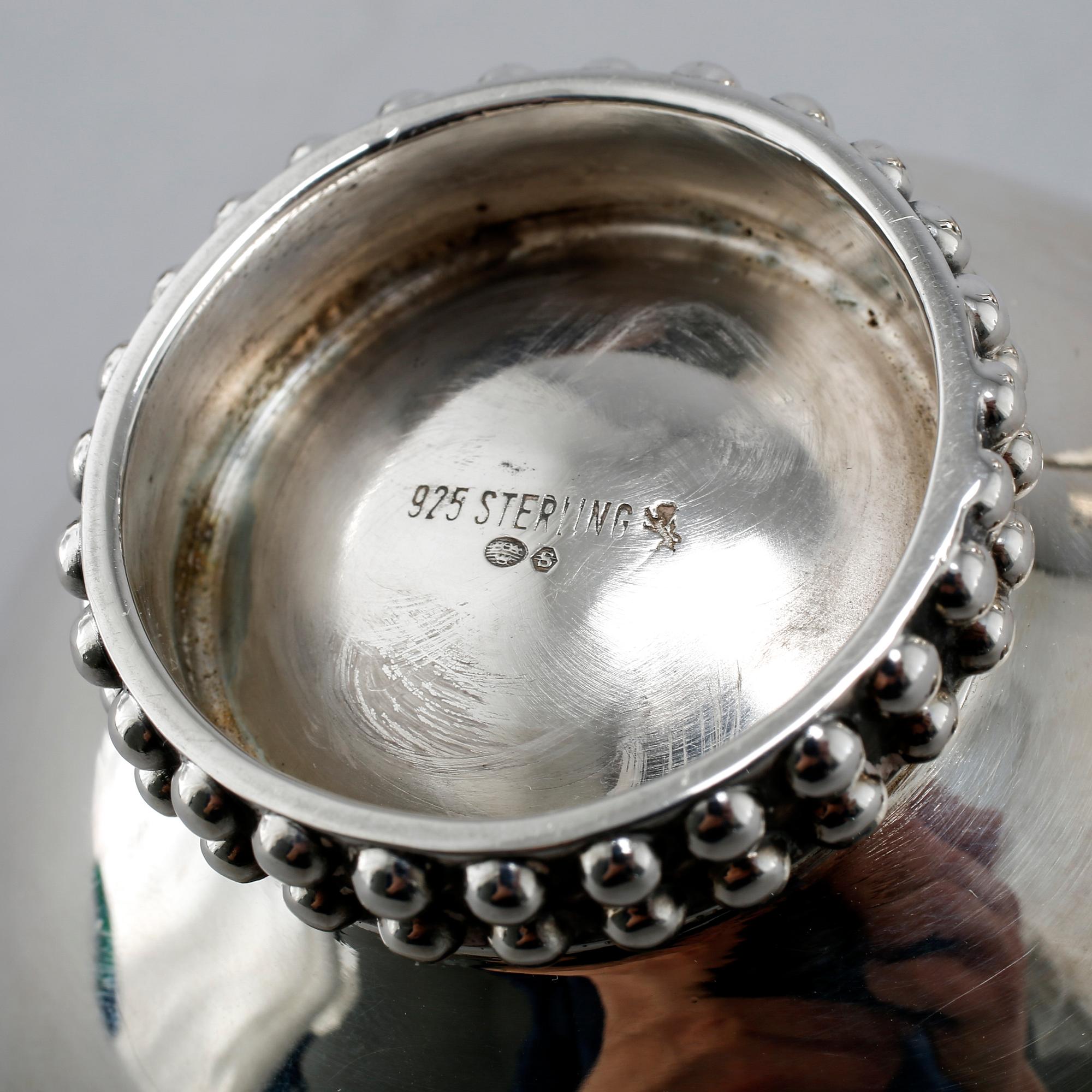 A silver coffee set of four pieces from the middle of the 20th century.