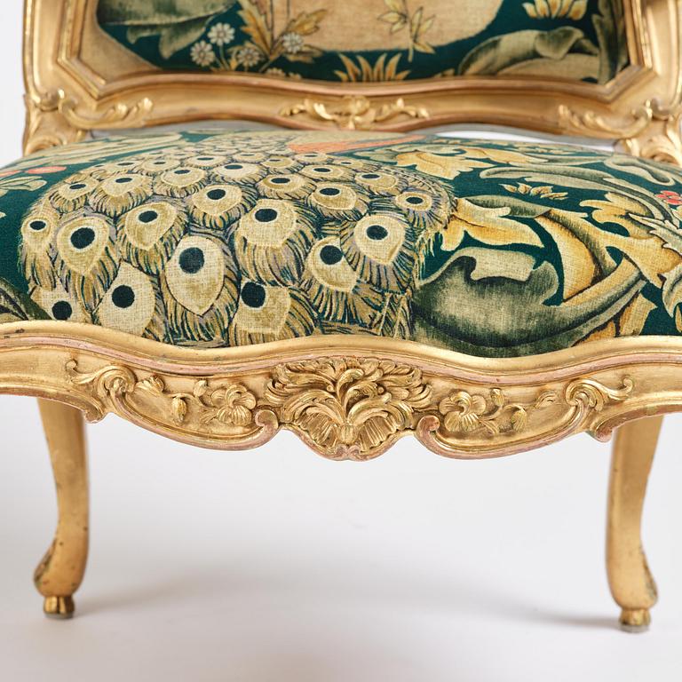 A pair of Louis XV-style giltwood fauteuils, late 19th century.
