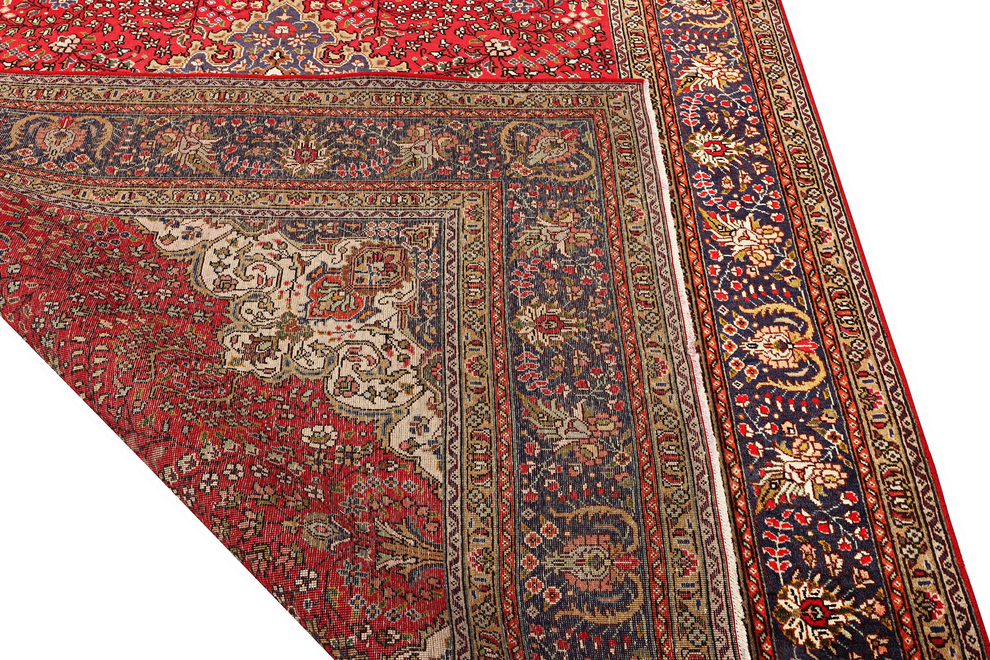 A Tabriz carpet, c 295 x 198 cm.
