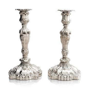 13. A pair of silver candlesticks, marks Gustaf Möllenborg, Stockholm 1845.