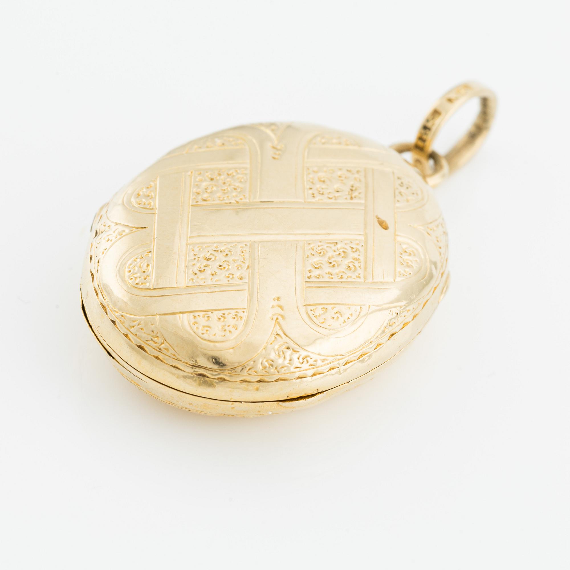 Medaljong/Fotogömma, 18K guld.