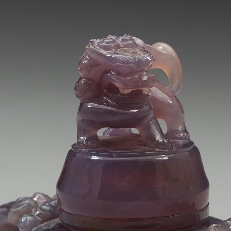 An amethyst tripod censer with cover, China, early 20th Century.