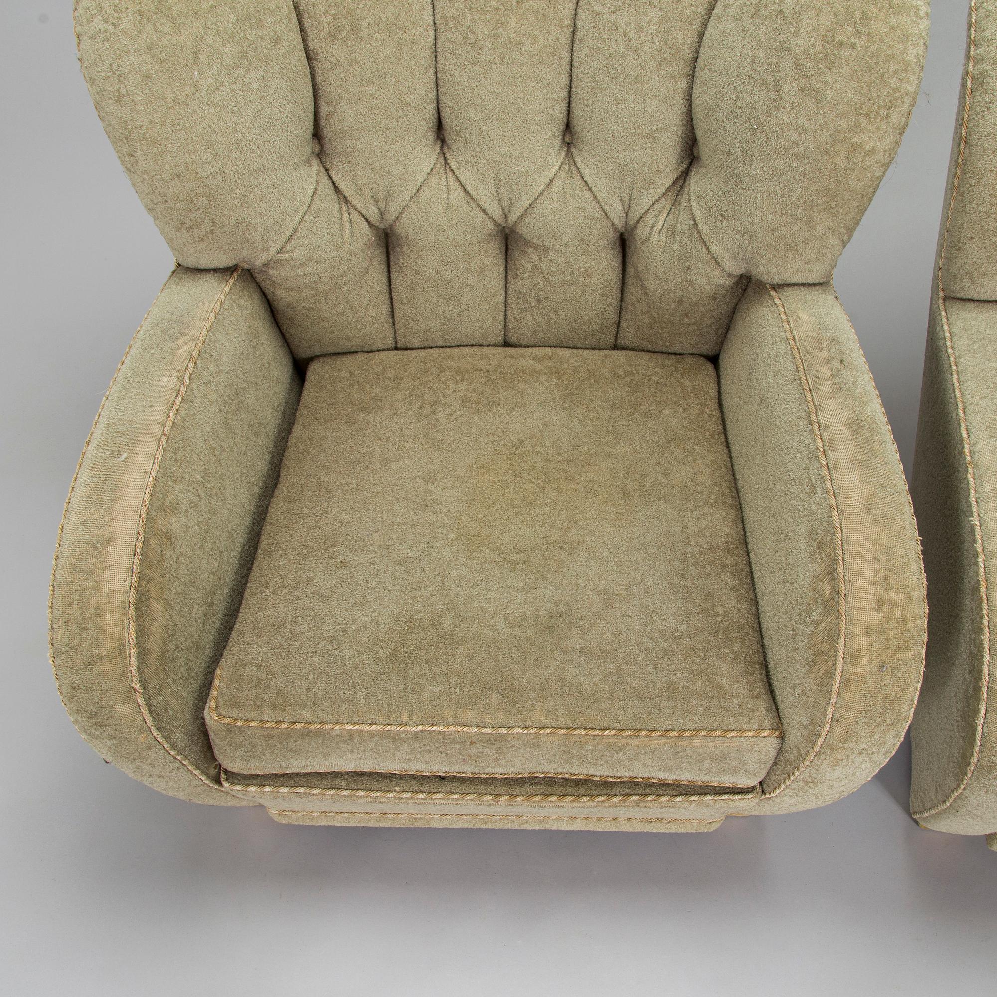 A pair of mid-20th century armchairs.