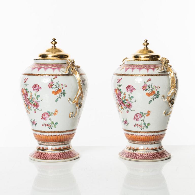 A pair of famille rose jars with gilded silver covers, Qing dynasty, Qianlong (1736-95).