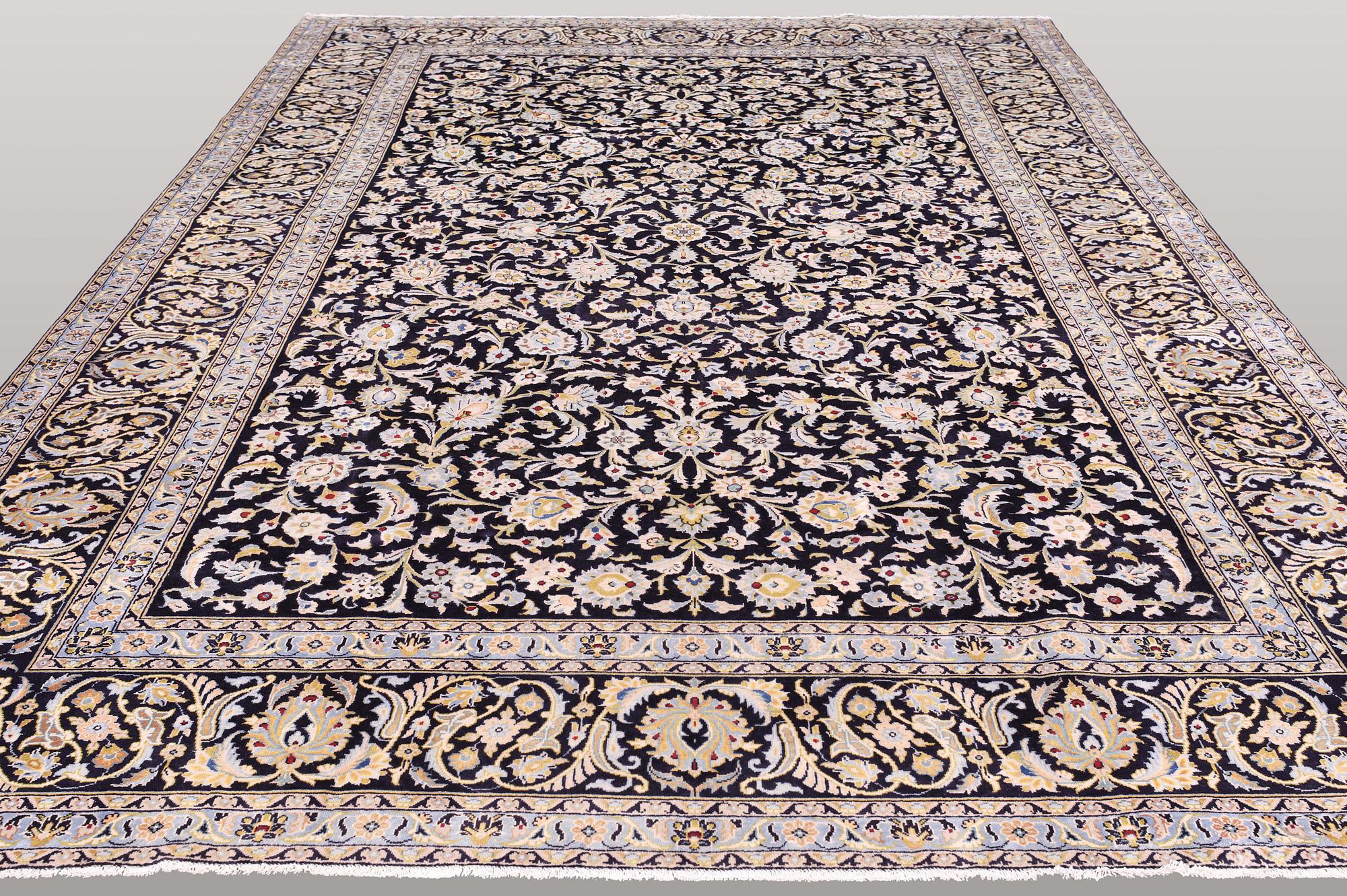 A carpet, Kashan, signed, ca 410 x 292 cm.