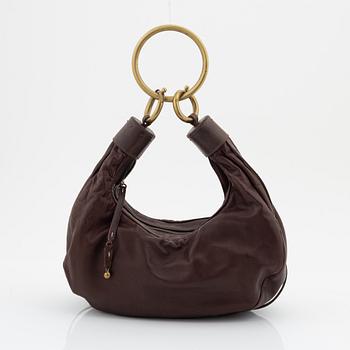 Chloé, a brown leather and brass bag.