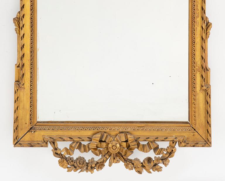 An end of the 19th Century Louis Xvi-style mirror.