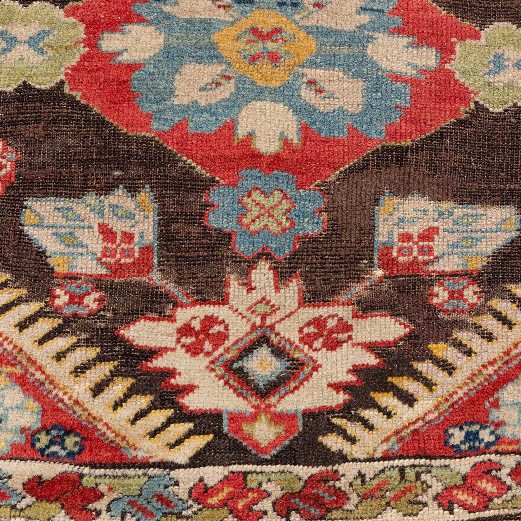 An antique Karabagh carpet,  ca 330 x 157 cm (one end with 1-3 cm flat weave).