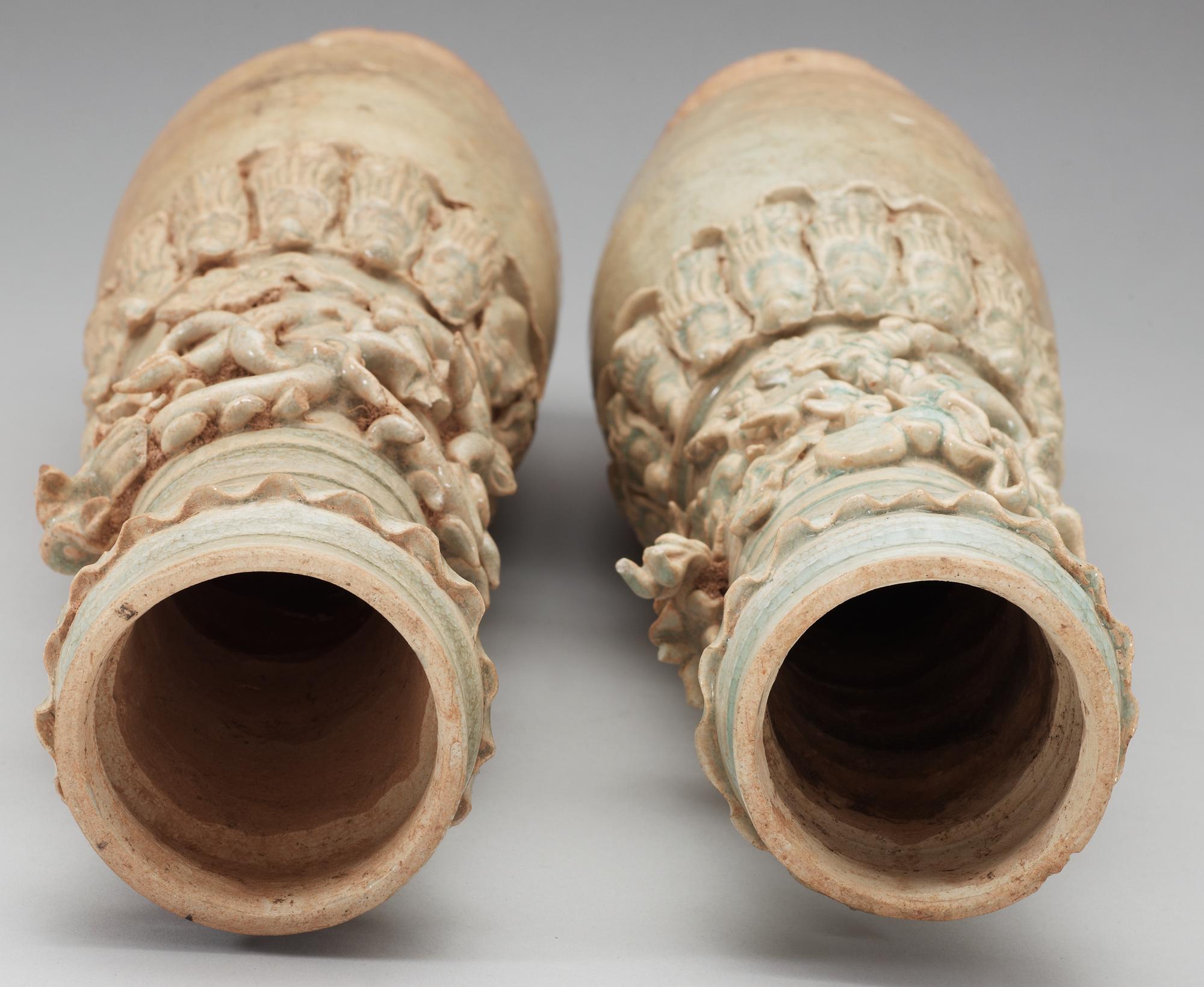 A set of two green glazed vases with covers, Yuan dynasty (1271-1368).