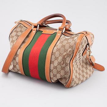 GUCCI, a bag.
