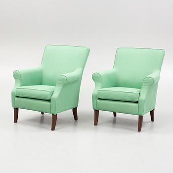 Marie Norell-Möller, a pair of "Leo" armchairs Norell Möbler, Sweden, and a foot stool.