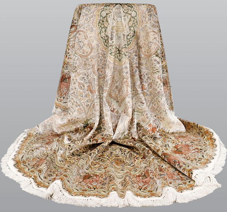 An oval pictoral silk carpet, ca 273 x 180 cm.