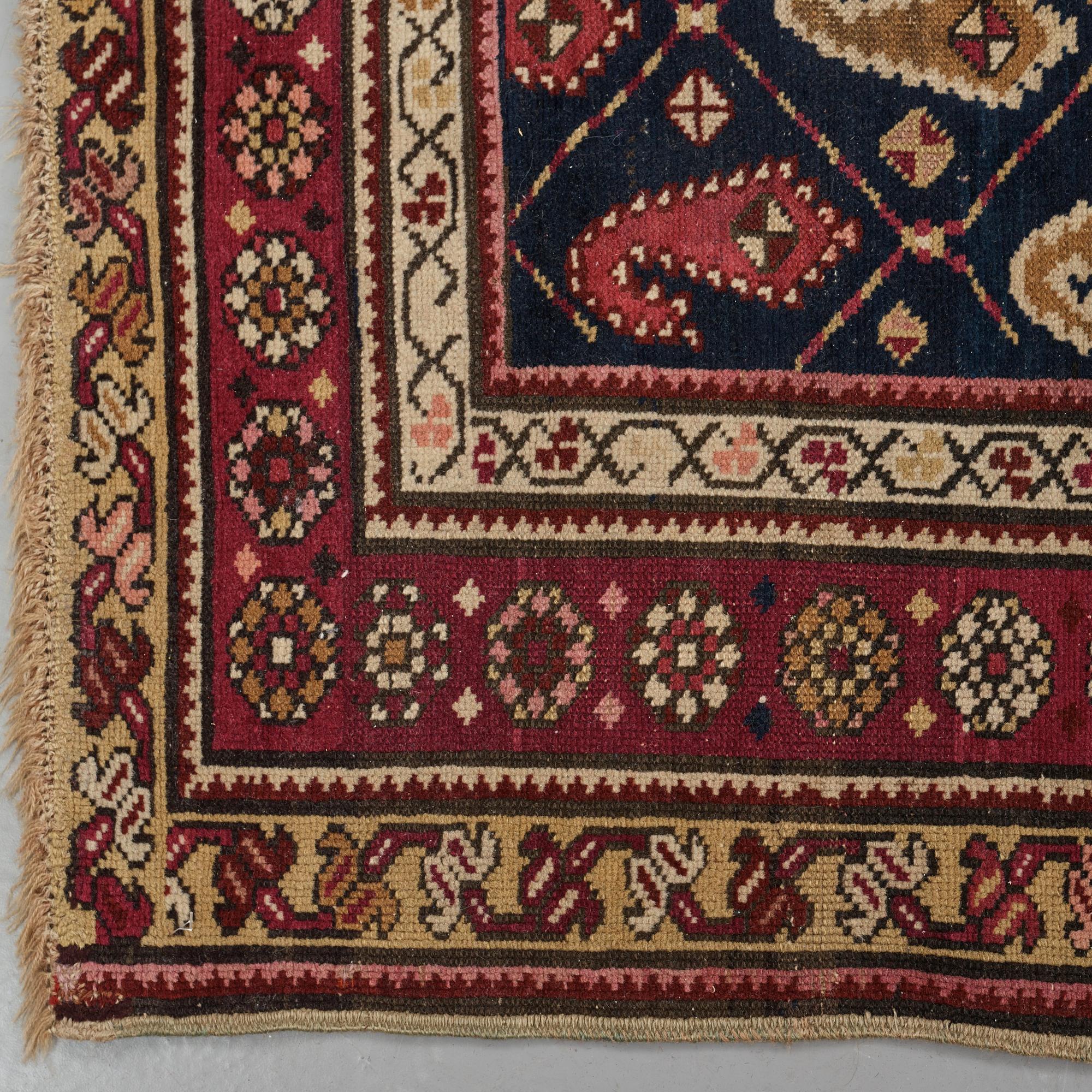Matto, a runner, an antique Karabagh, ca 268,5-278 x 98,5-103,5 cm.