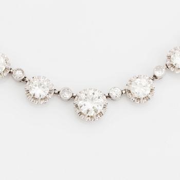 A platinum necklace set with old-cut diamonds.