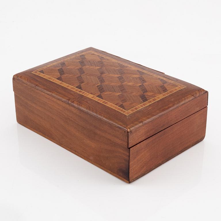 A ring in 18K white gold set with a yellow faceted tourmaline and rose-cut diamonds.