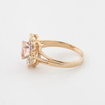 A morganite and brilliant cut diamond ring.