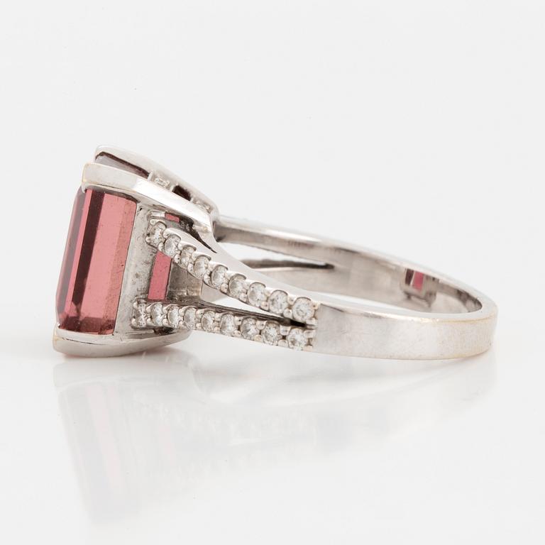 An emerald-cut pink tourmaline and diamond ring.