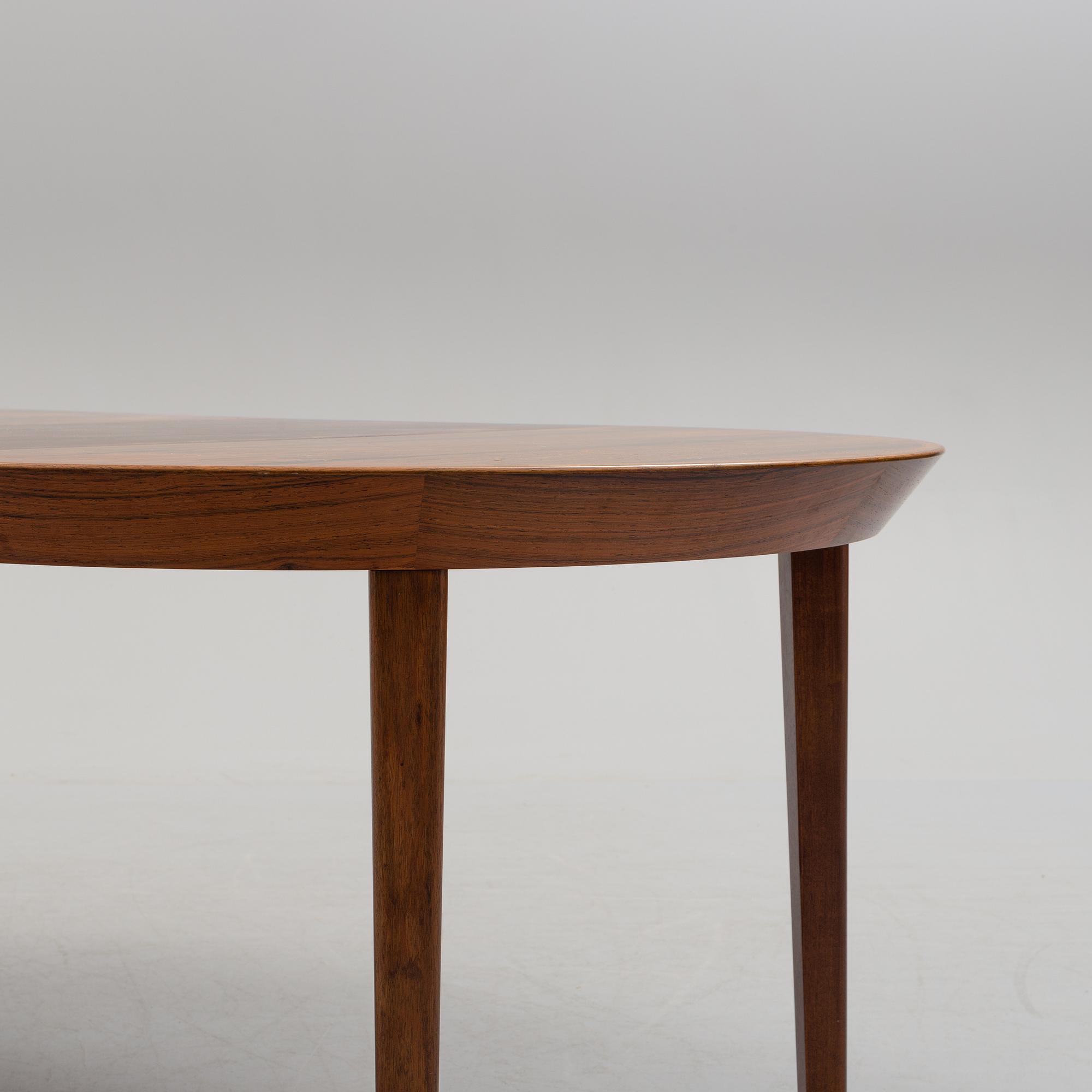 A 1950s/1960s rosewood veneer table.