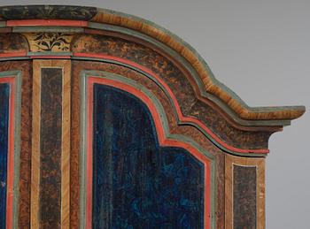 A polychrome-painted folk art cabinet from Värmland, Sweden, dated 1818.