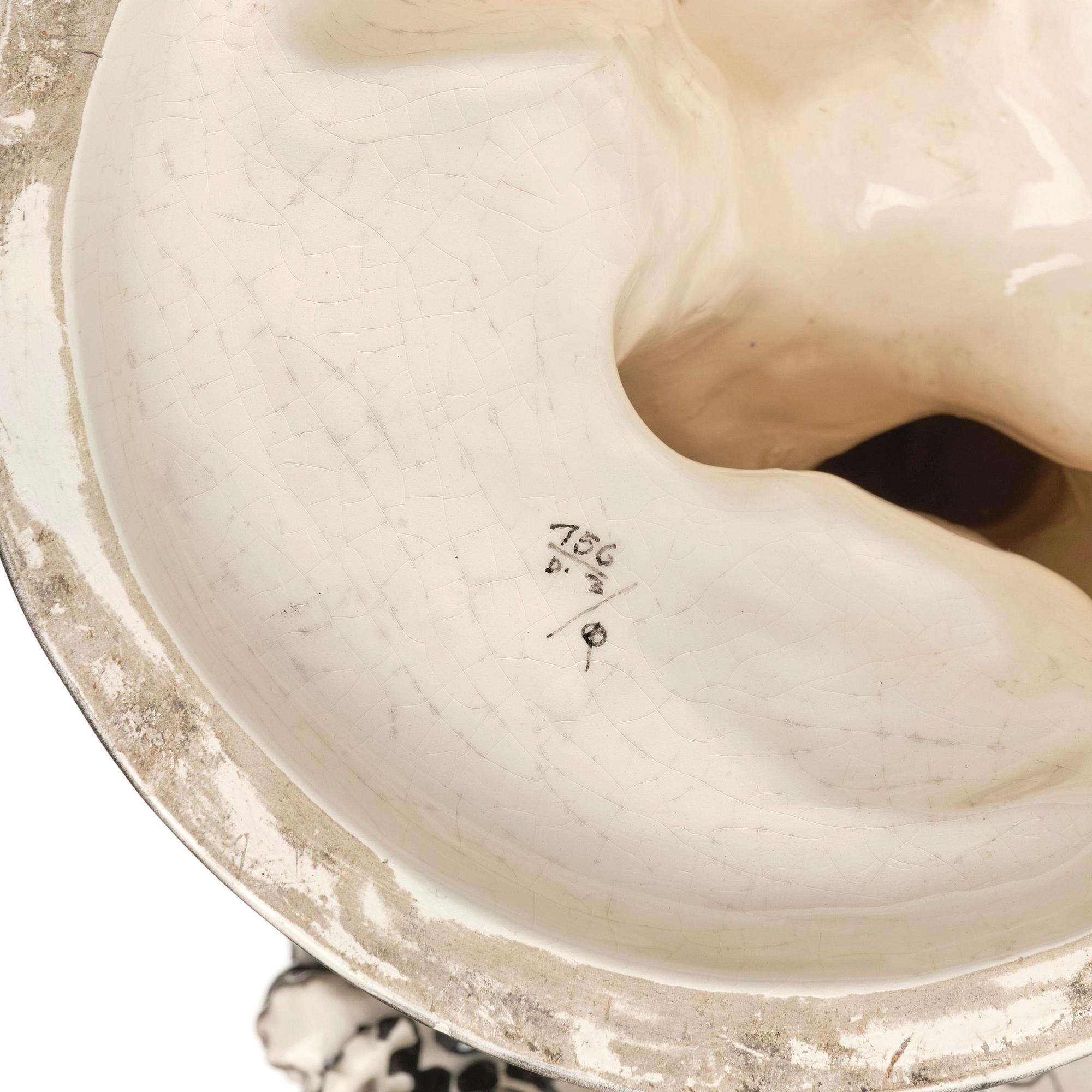 Bertold Löffler, a ceramic sculpture of a putto with cornucopia, model 156, Wiener Keramik, Vienna, Austria, 1908- 1912.