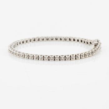 Tennis bracelet, 14K white gold and brilliant-cut diamonds.